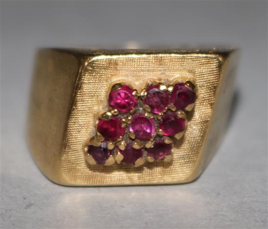 An 18ct gold and ruby cluster cocktail ring, size K.